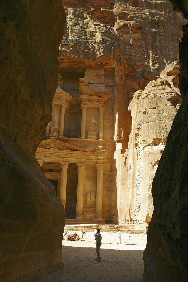 Al-Khazneh, cut out from the red sandstone meets the visitors in Petra (UNESCO world heritage site). Jordan