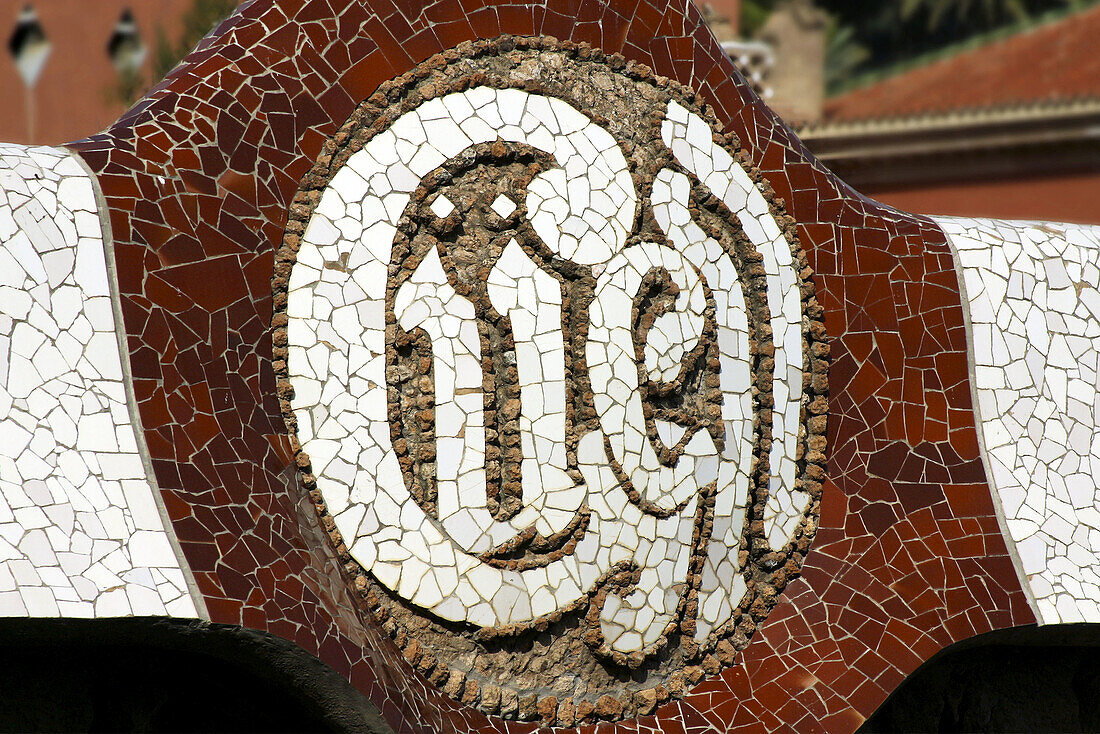 Logo mosaic in the Güell Park (Gaudí, 1900-1914). Barcelona. Spain
