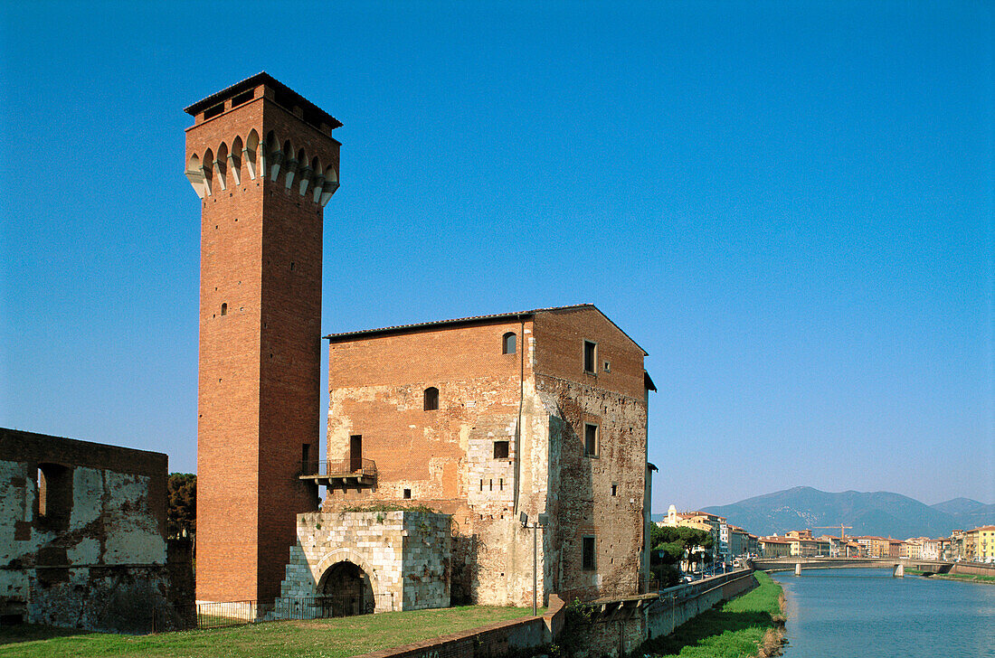 Ancient fortress along Arno River. Pisa. Italy