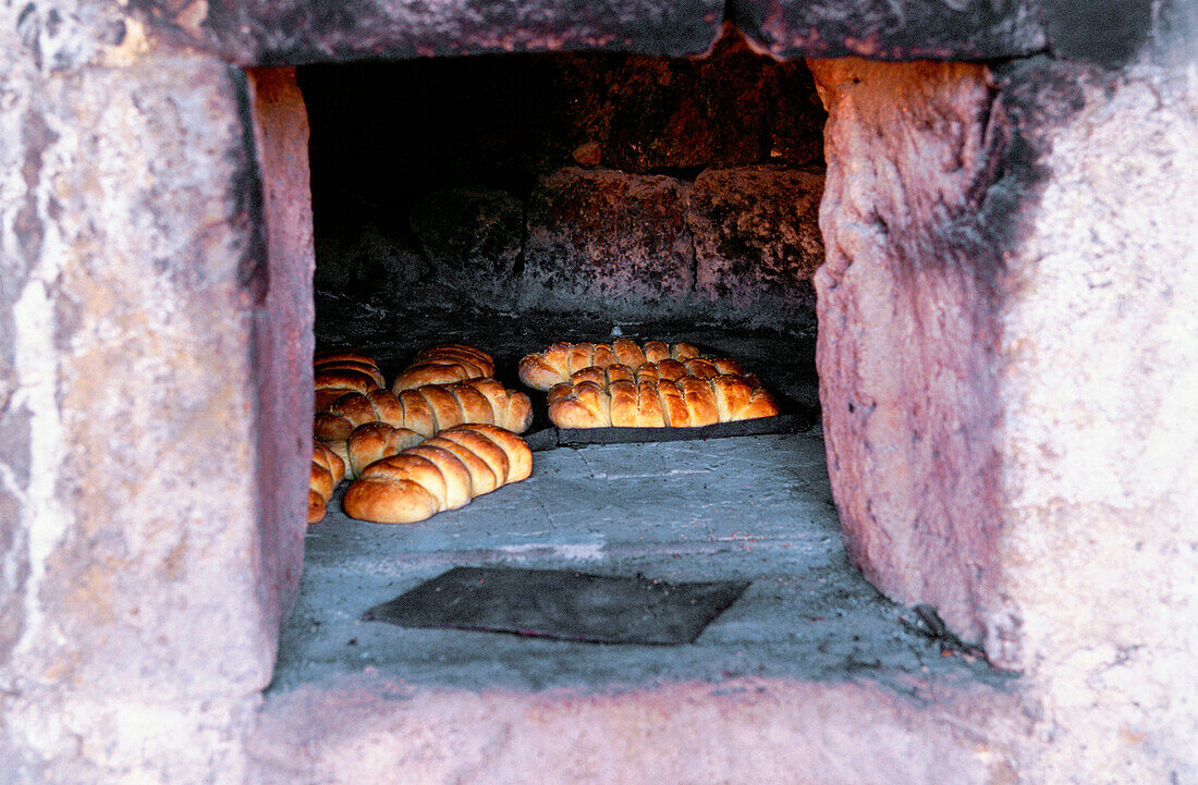 Typical bread in the oven of a farmer. Valle di Monasterio. Pantelleria. Sicily. Italia