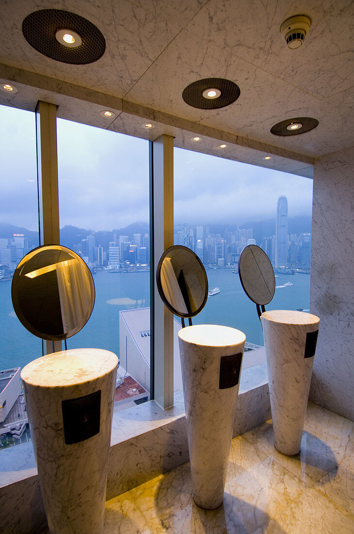 View of Hong Kong Bay from Felix Restaurant (Women s bathroom) designed by Philippe Starck at Peninsula Hotel. Hong Kong. China.