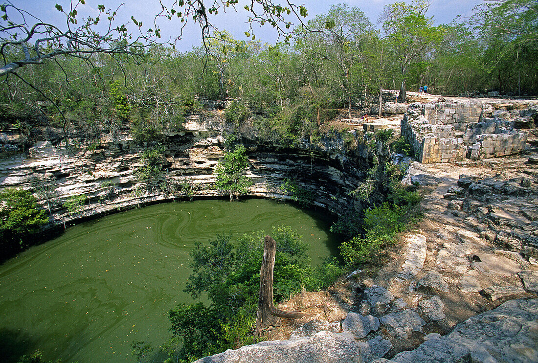 View of the Sacred Cenote (UNESCO World Heritage). Chichen Itza. Yucatan. Mexico.