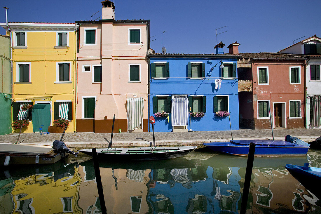 Laguna (lagoon) di Venezia. Burano. A canal with the typical colourful houses. Venice. Italy