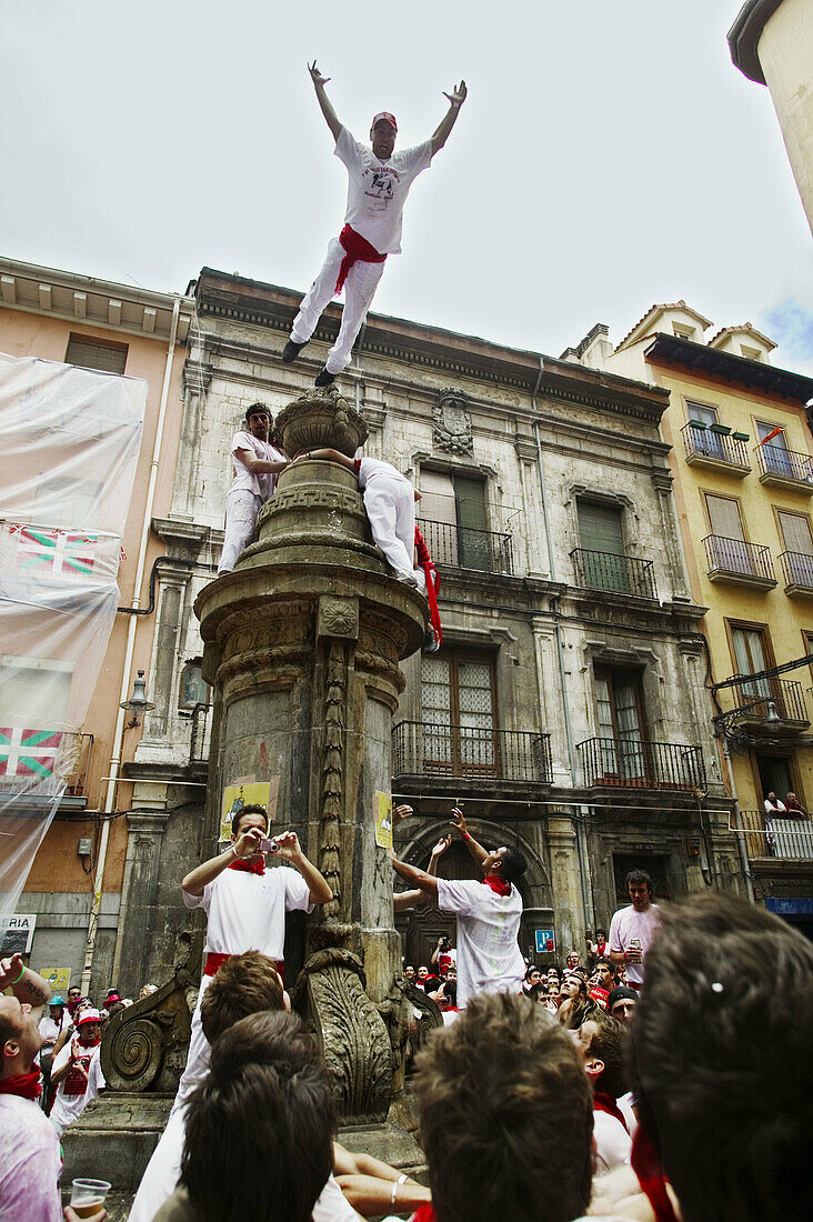 Fountain jumping during San Fermin Festival. Navarreria fountain (aka Santa Cecilia fountain). Pamplona. Navarre, Spain