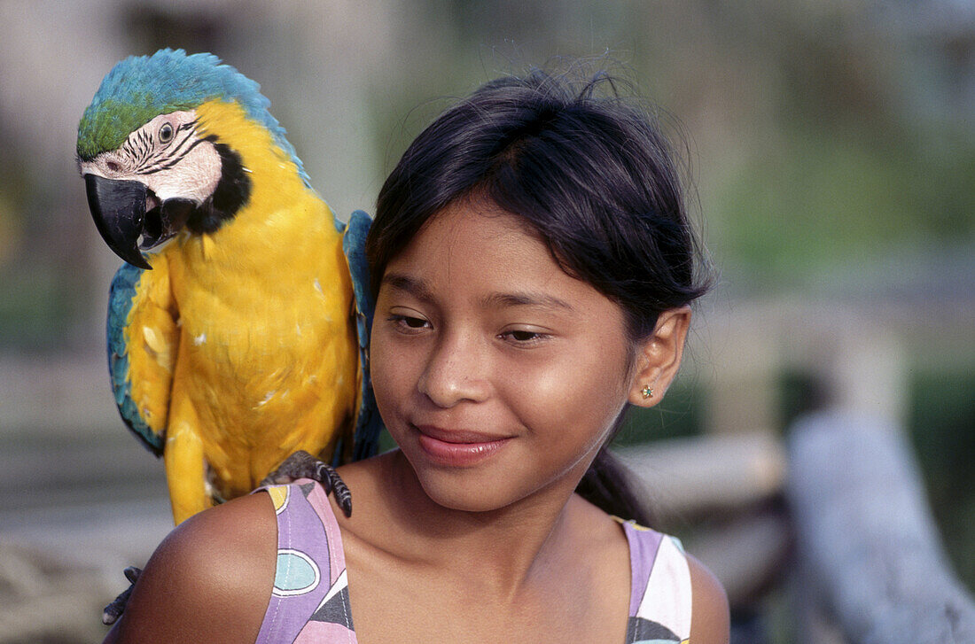 Guayo girl with macaw. Orinoco. Venezuela.