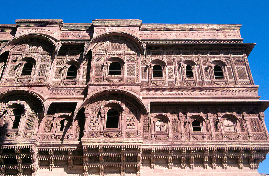 Carved windows and arches in stonework. Mehrangarh Fort. Jodhpur. India