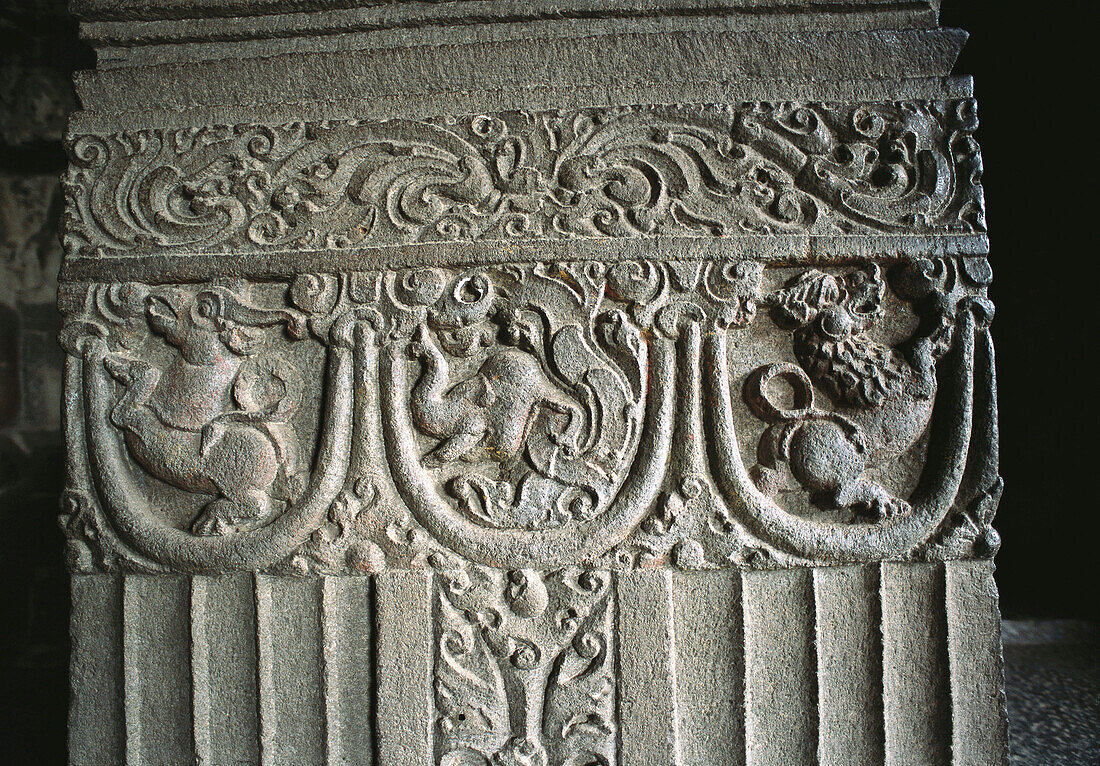Carved reliefs on pillar at temple, Ellora Caves (cave num. 32). Aurangabad, Maharashtra state. India