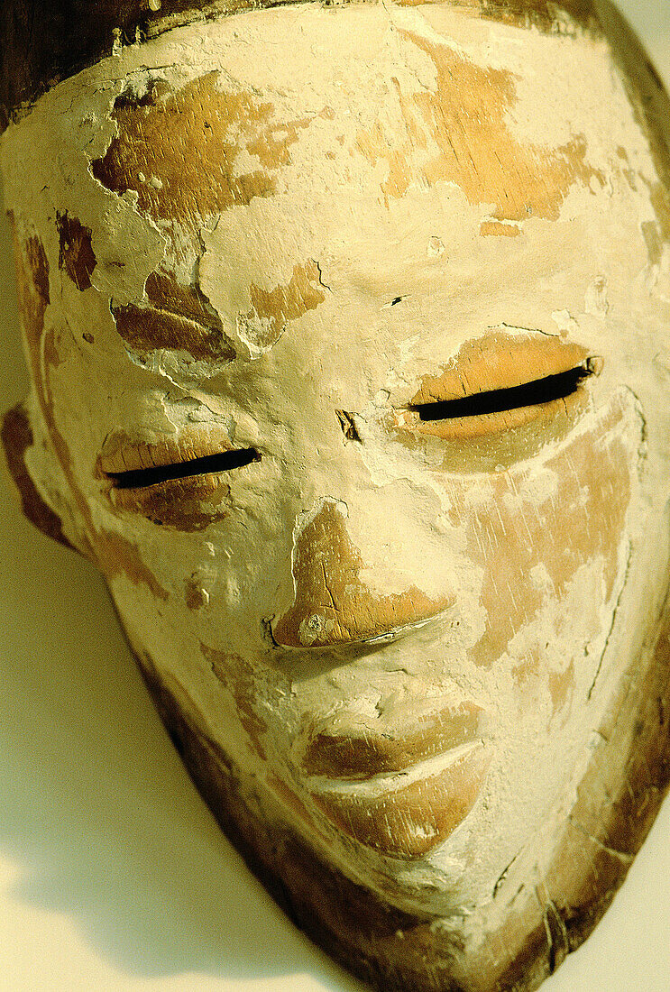 Punu ancient mask painted with kaolin for secret ceremonies. Gabon
