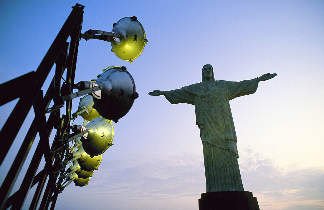 Corcovado Christ by french sculptor Landowsky (1931) and spotlights at dusk. Rio de Janeiro. Brazil