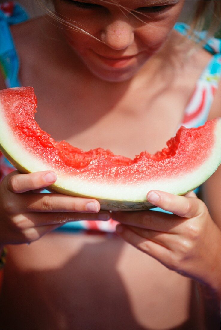 A girl eating watermelon