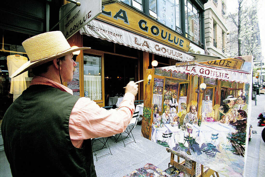 Painter at La Goulue French restaurant, Manhattan. New York City, USA