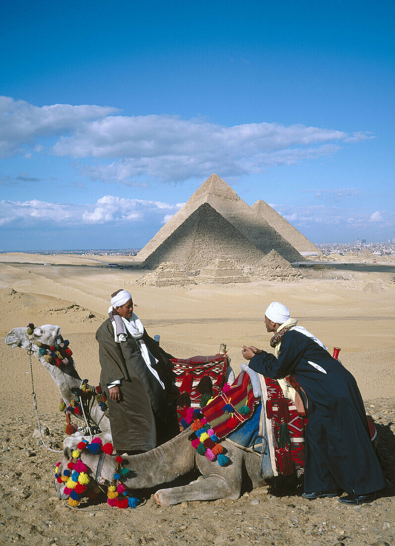 Camel riders. Pyramids of Gizeh. Egypt