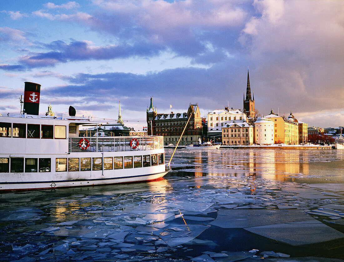 Small ferries in front of Riddarholmen island in winter. Stockholm. Sweden