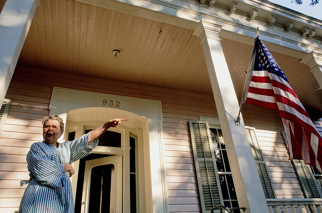 Patriotic woman by her house. New Orleans. Louisiana. United states (USA)