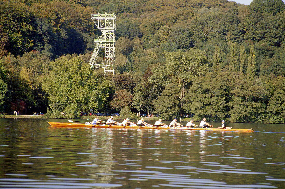 Rowing boat, coxed eight with Coxswain, Shaft Tower in the background, Baldeney Lake, Essen, Ruhr Valley, Ruhr, Northrhine, Westphalia, Germany
