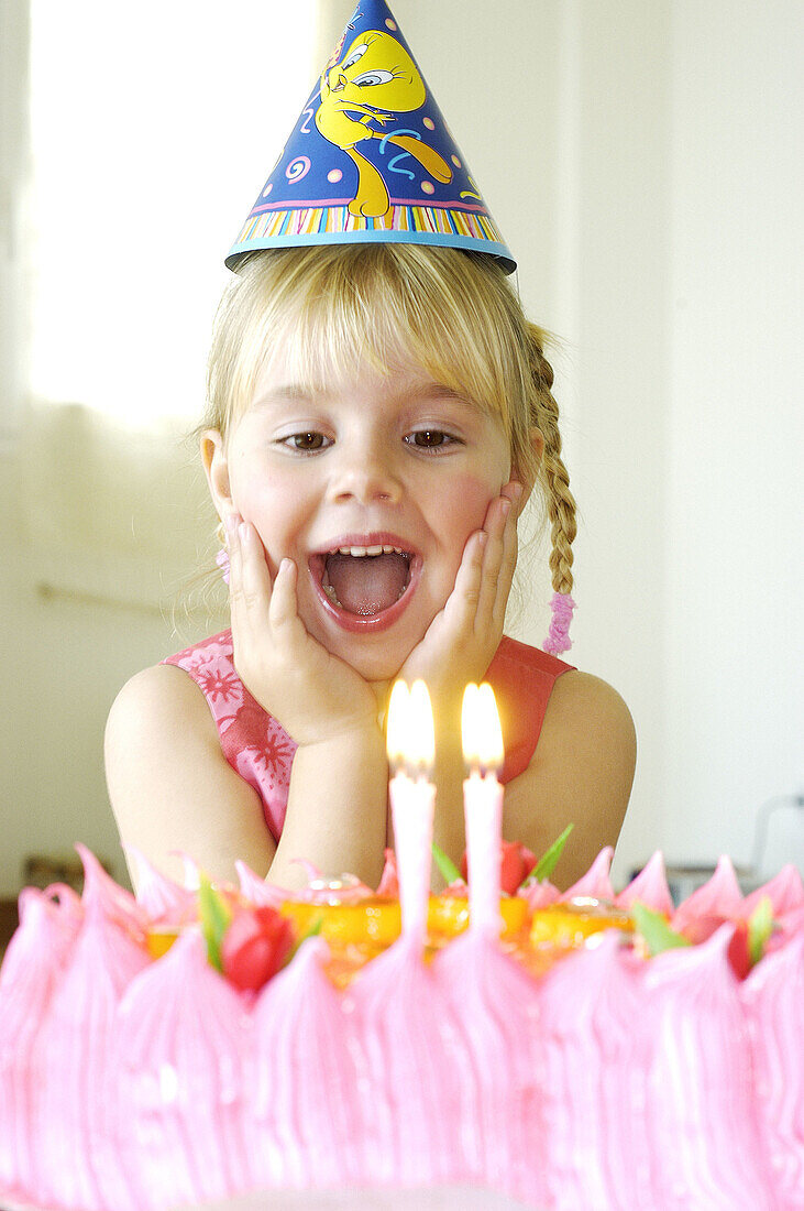 Blonde, Blondes, Blow, Blowing, Cake, Cakes, Candle, Candles, Cap, Caps, Caucasian, Caucasians, Child, Childhood, Children, Color, Colour, Contemporary, Emotion, Emotions, Excited, Excitement, Express