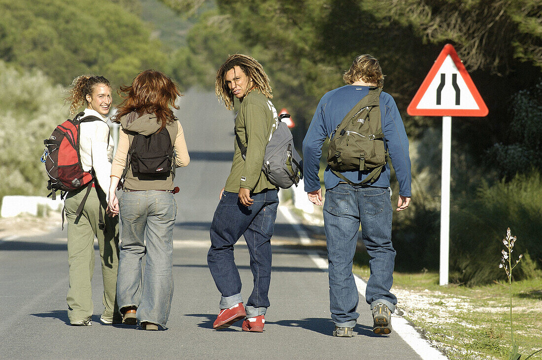 Backpackers, Backpacking, Boy, Boys, Caucasian, Caucasians, Color, Colour, Companion, Companions, Contemporary, Country road, Country roads, Daytime, Dreadlock, Dreadlocks, Exterior, Female, Four, Fo