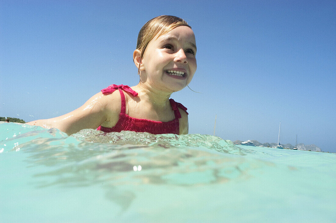 young girl in caribbean sea