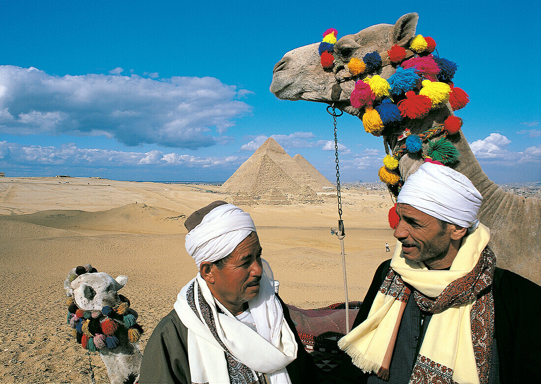 Camel riders. Pyramids of Gizeh. Egypt
