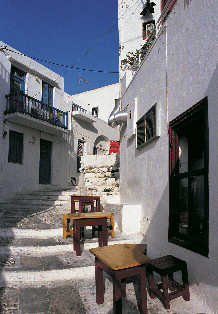 Street and tables. Mykonos. Greece