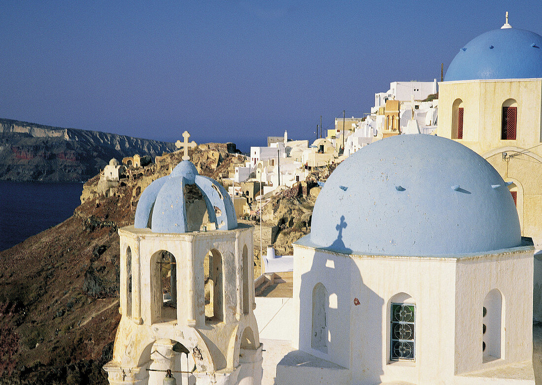 Ia village. Churches Domes and belfries painted in blue. Santorini. Greece