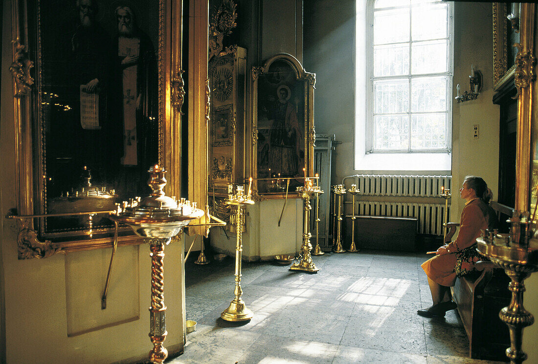 People at prayer in chapel. St. Petersburg. Russia