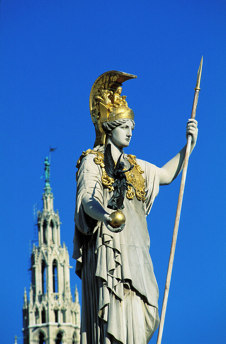 Pallas Statue at the Parliament, City Hall belfry in background. Vienna. Austria