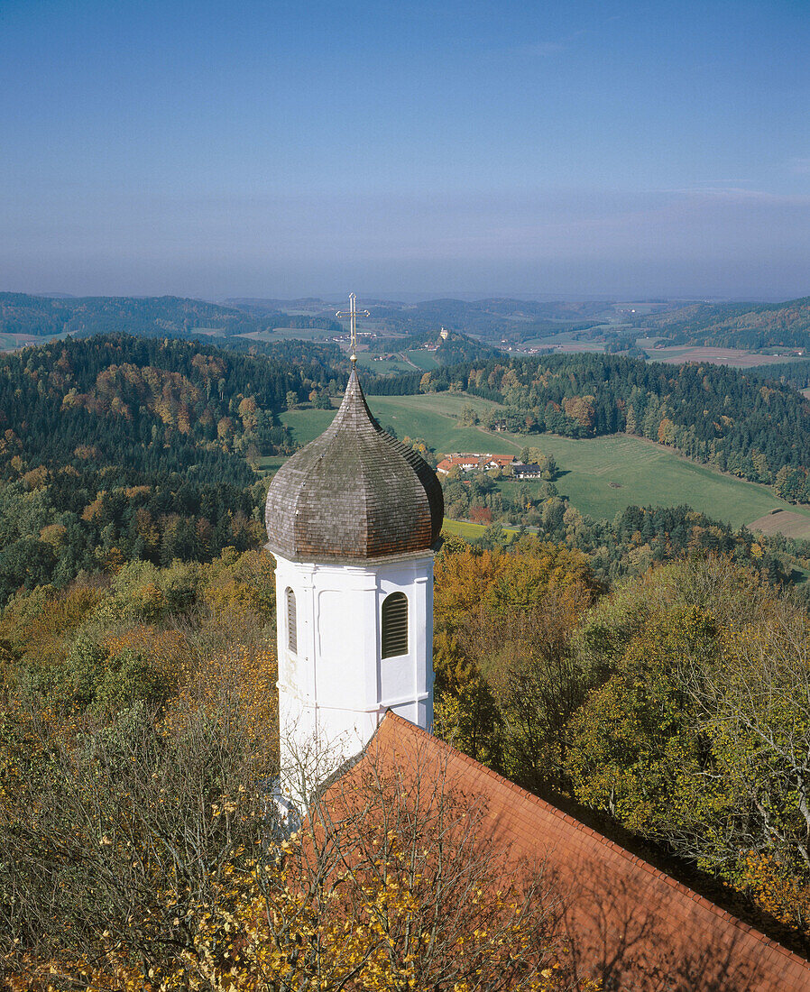 Church tower and roof in autumn. Bavaria, Germany
