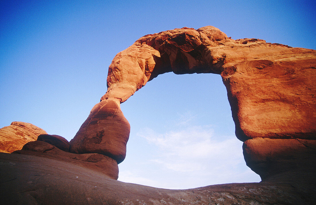 USA, Utah, Moab. The Delicate Arch at sunset, most famous of the Arches National Park features.