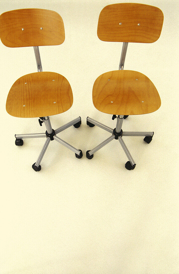  Alike, Chair, Chairs, Color, Colour, Furniture, Indoor, Indoors, Inside, Interior, Object, Objects, Office chair, Office chairs, Office furniture, Pair, Same, Sameness, Thing, Things, Two, Two items, Vertical, View from above, Wood, Wooden, B19-214279, a