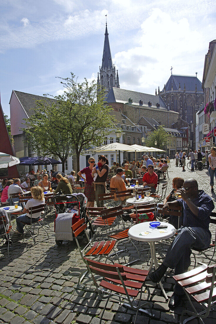 Open air cafes at Hof Square with reconstructed roman arches. Aachen, North Rhine-Westphalia, Germany