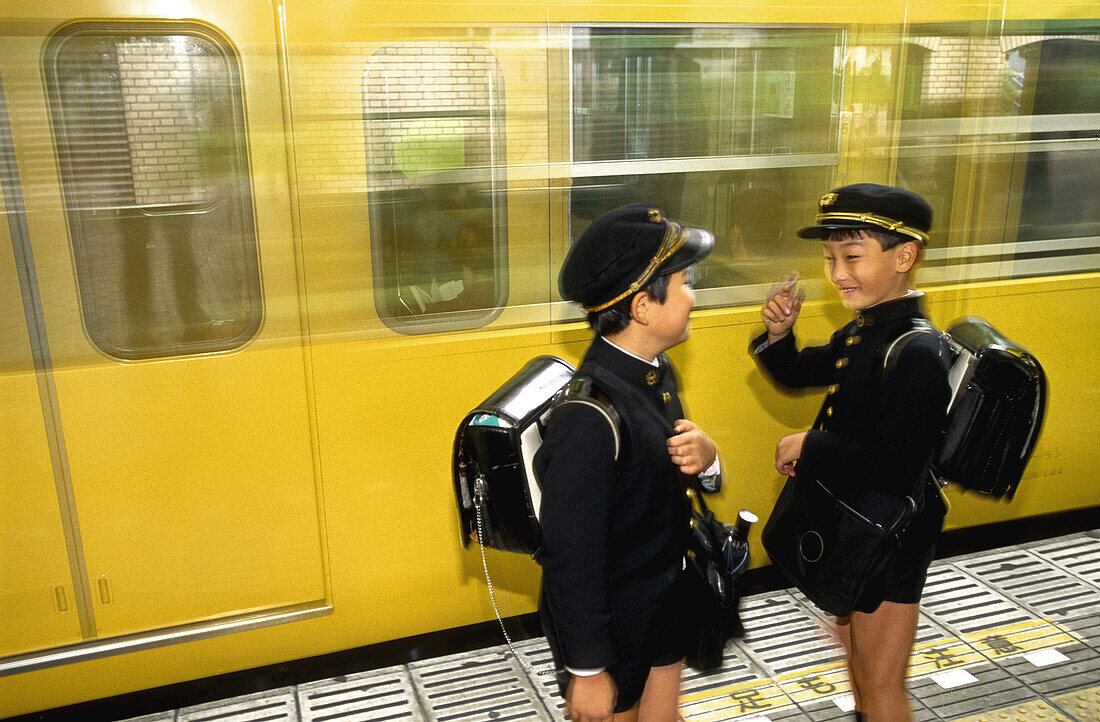 Schoolboys in black uniform in subway. Tokyo, Japan
