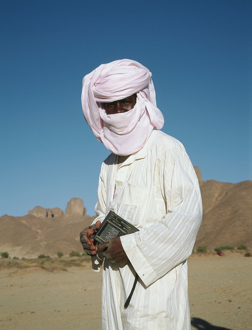 Tuareg men wearing the white chech (local turban or veil). Sahara desert. South Algeria