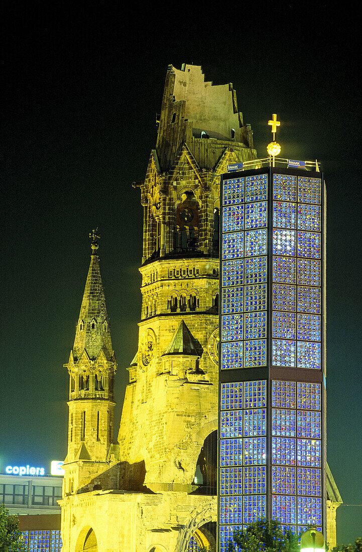 Kayser Wilhem Gedachniskirche (memory church) built in 1895 and bombed during World War II, now a war disaster symbol. New part built in 1965 by architect Egon Eiermann. Breidscheidplatz. Berlin. Germany