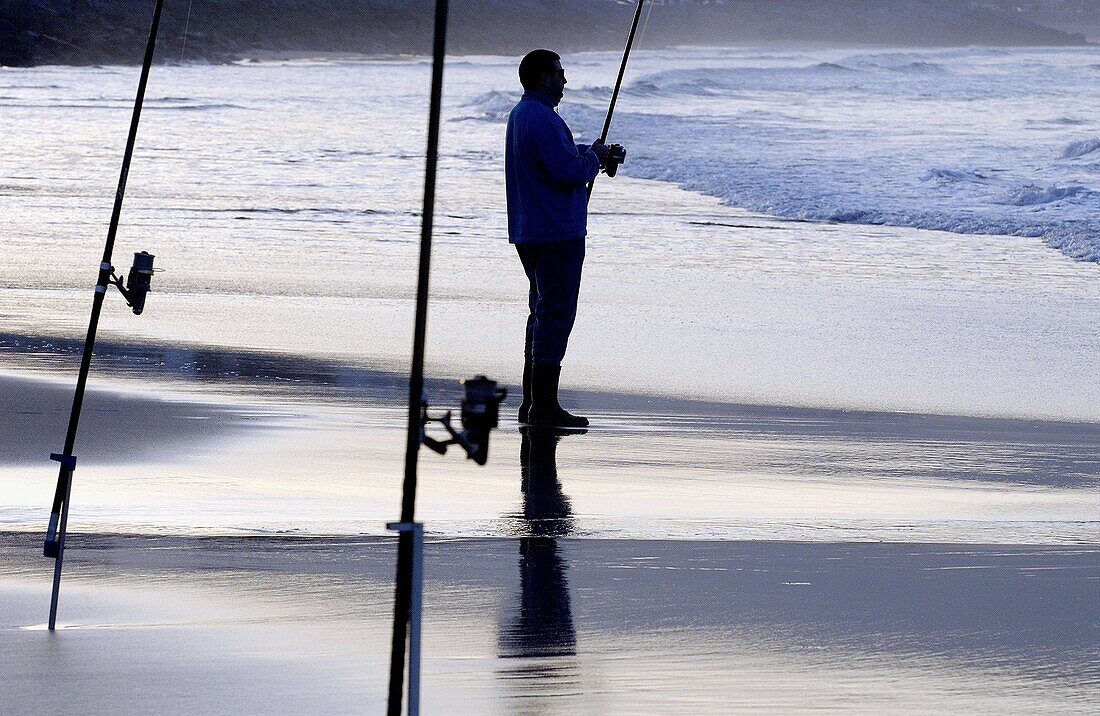 Sport fishing at beach. Hendaye, Aquitaine. France