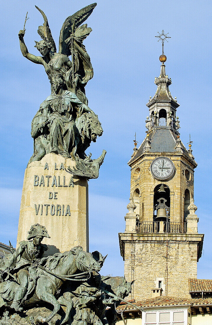 Church of San Miguel and monument in Plaza de la Virgen Blanca square. Vitoria, Álava province. Euskadi, Spain