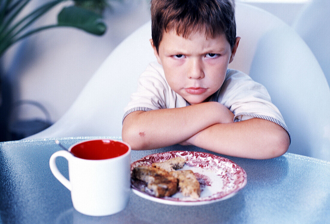  Child, Childhood, Children, Color, Colour, Cross arms, Crossing arms, Cup, Cups, Disgust, Dish, Dishes, Facial expression, Facial expressions, Food, Horizontal, Human, Indoor, Indoors, Infantile, In