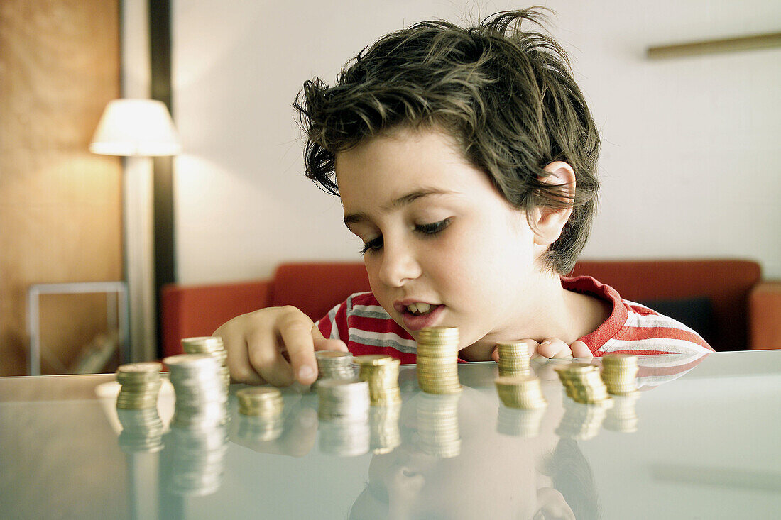  Boy, Boys, Cash, Caucasian, Caucasians, Child, Childhood, Children, Coin, Coins, Color, Colour, Contemporary, Count, Counting, Counts, Economy, Facial expression, Facial expressions, Glass, Grin, Grinning, Heap, Heaped, Heaps, Human, Indoor, Indoors, Inf