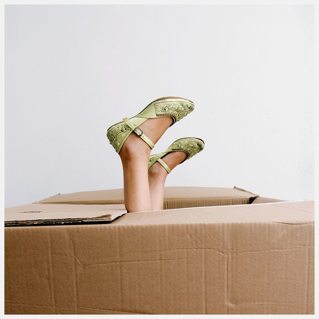 Amusing, Box, Boxes, Child, Children, Color, Colour, Contemporary, Feet, Female, Foot, Funny, Girl, Girls, Human, Indoor, Indoors, Interior, Kids, Odd, One, One person, Package, Packages, Parcel, Parcels, People, Person, Persons, Shoe, Shoes, Single pers