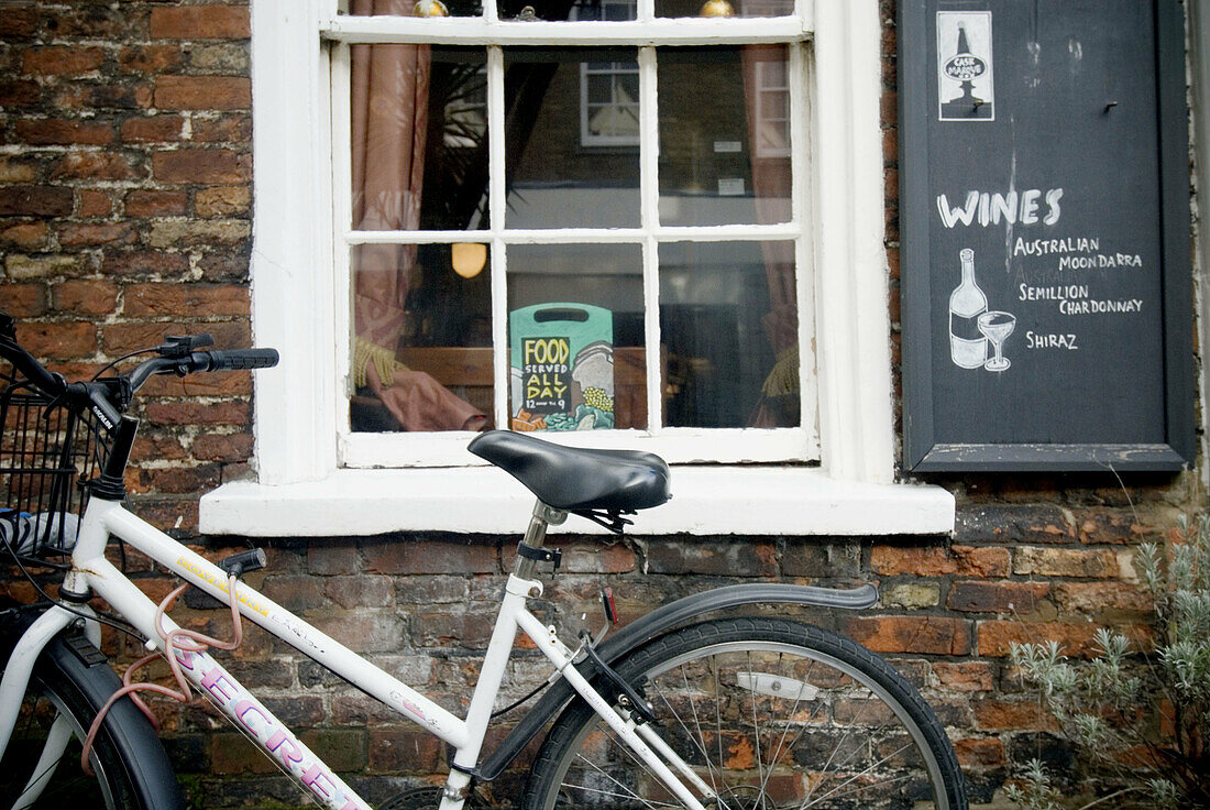 Window pub and bicycle in little village. Suffolk, England, UK