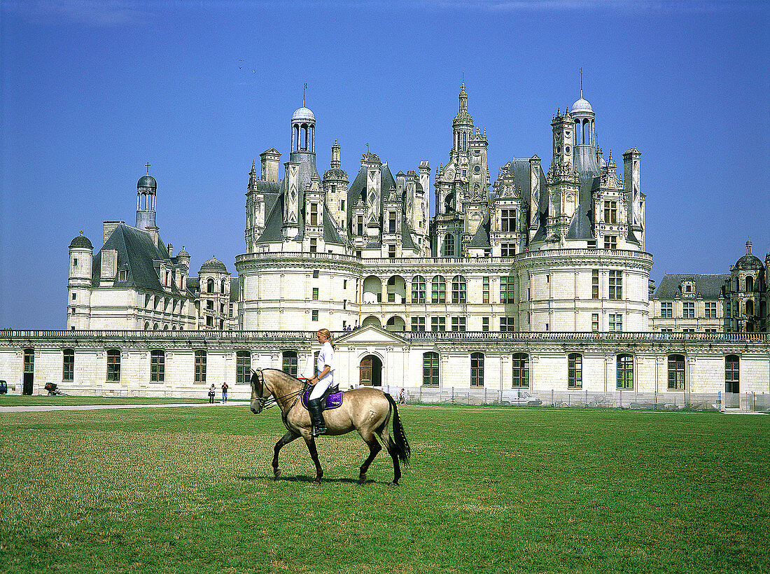 Horsewoman in front of Chambord Castle. Val-de-Loire. France