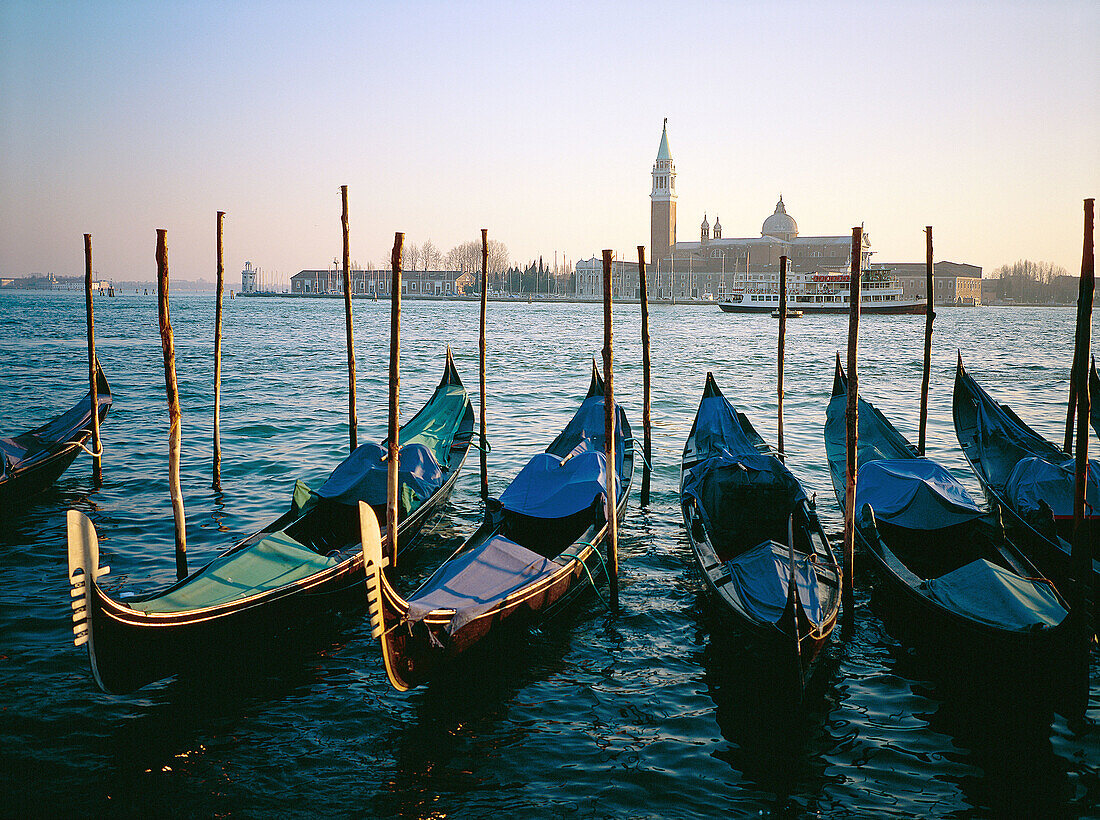 Gondolas pier and San Giorgio Maggiore church in background. Venice. Italy