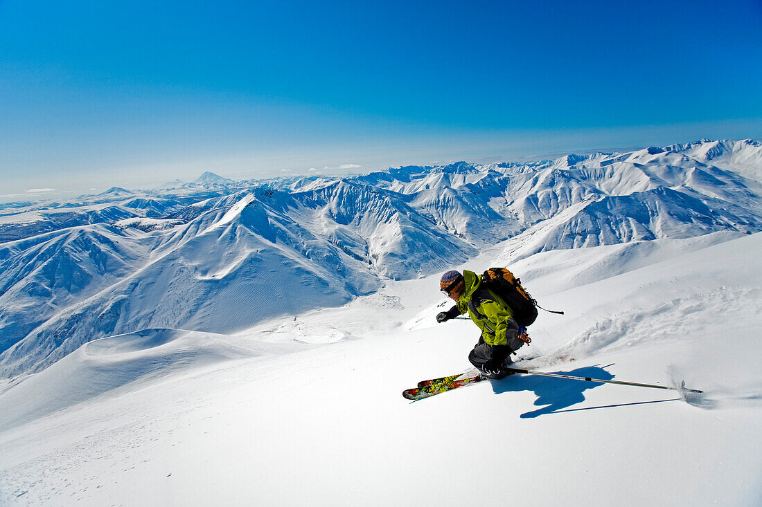 Skier in deep snow, Heliskiing, Kamchatka Peninsula, Sibiria, Russia