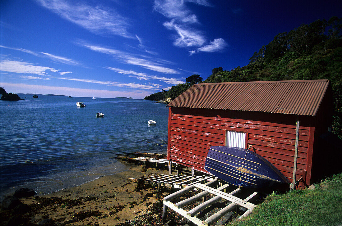 Boathouse in a small bay, Steward Island, New Zealand