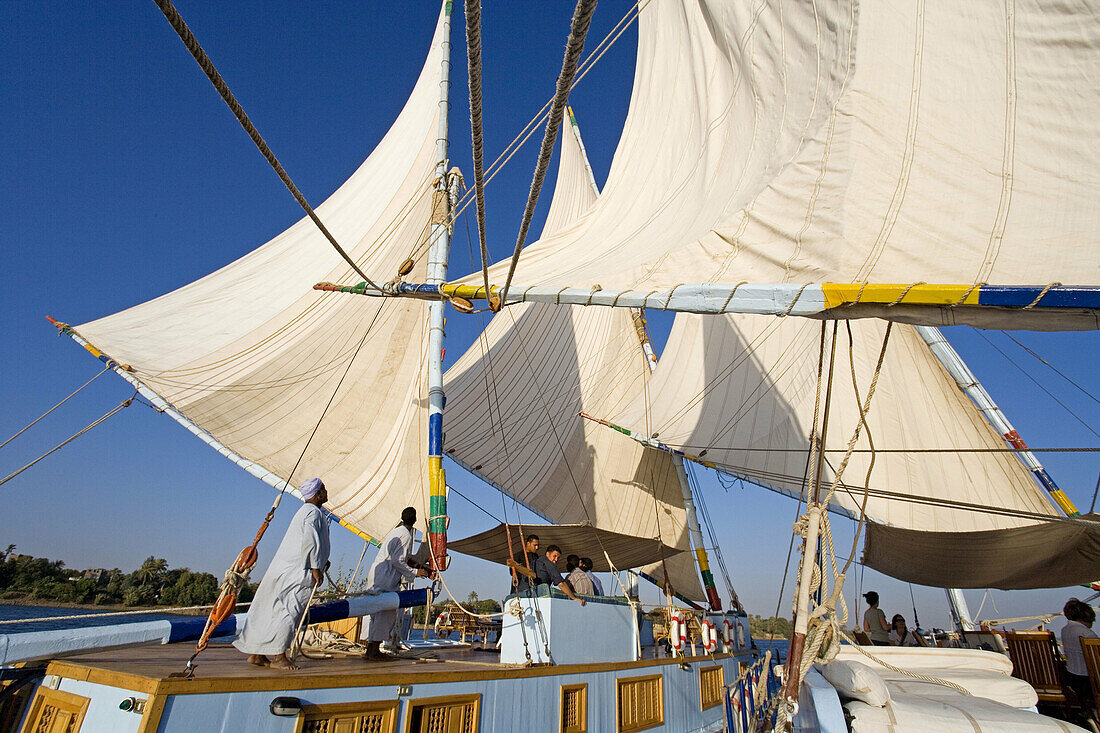 Twin masted large feluccas known as sandals . They were used formerly to carry stones and have been refurbished with a deck and cabins for sailing cruises on river Nile, south or north of Luxor. Upper. Egypt