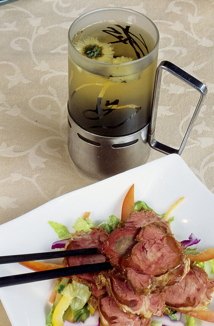 Pork roll and Longjing green tea: high class Shanghai cuisine at upscale Yè Shanghai restaurant in the French Concession colonial town. Shanghai. China