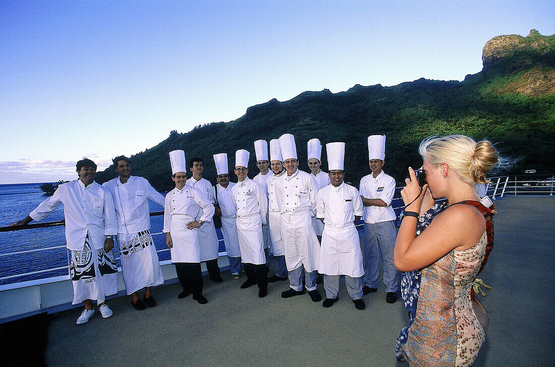 Chefs and cooks posing for picture at deck of MS Paul Gauguin. French Polynesia