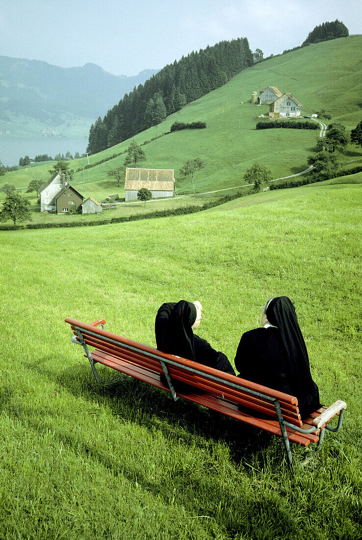 Two nuns sitting on a bench. Apenzell. Switzerland