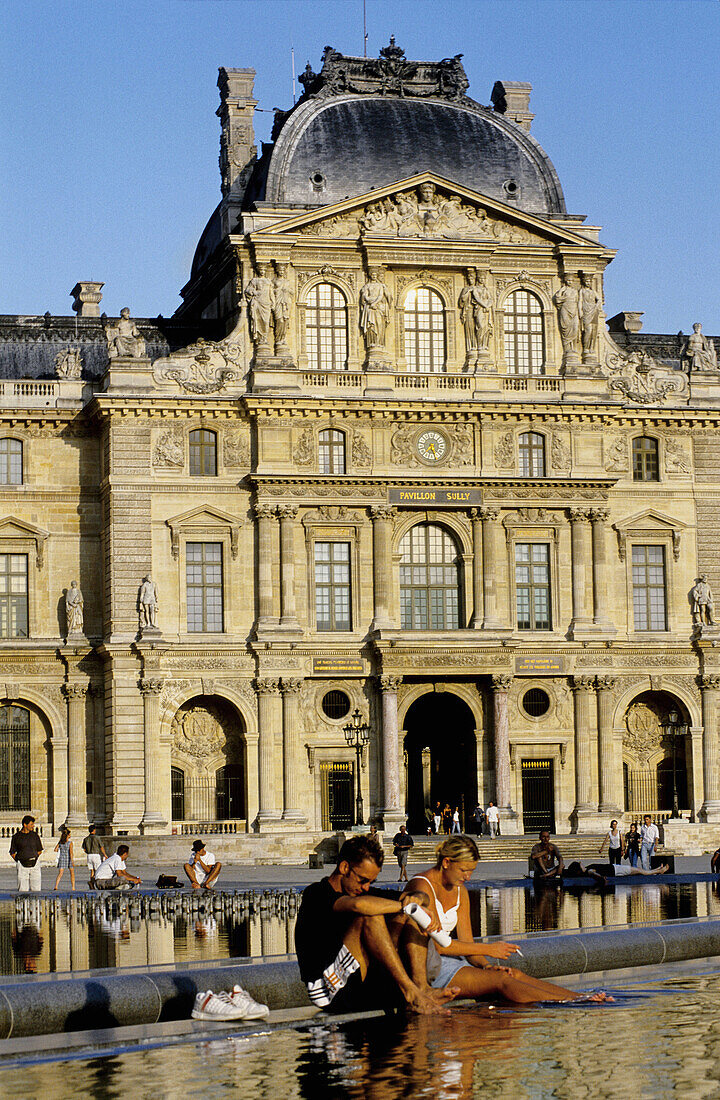 Tuileries gardens and Musee du Louvre in Summer Paris. France.