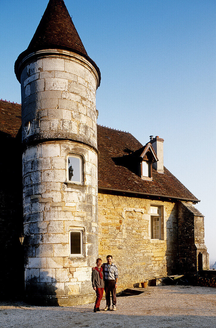 Benigne Joliet and his wife, wine growers, by their medieval manor. Cistercian cellars of Clos de la Perrière. Fixin. Côte d Or. Burgundy. France.